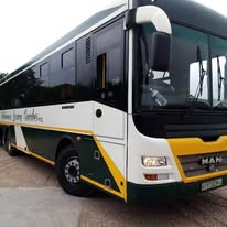 White Mabirimisa coach with green and gold detailing